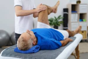 Patient having their leg checked during consultation with doctor for diabetic neuropathy