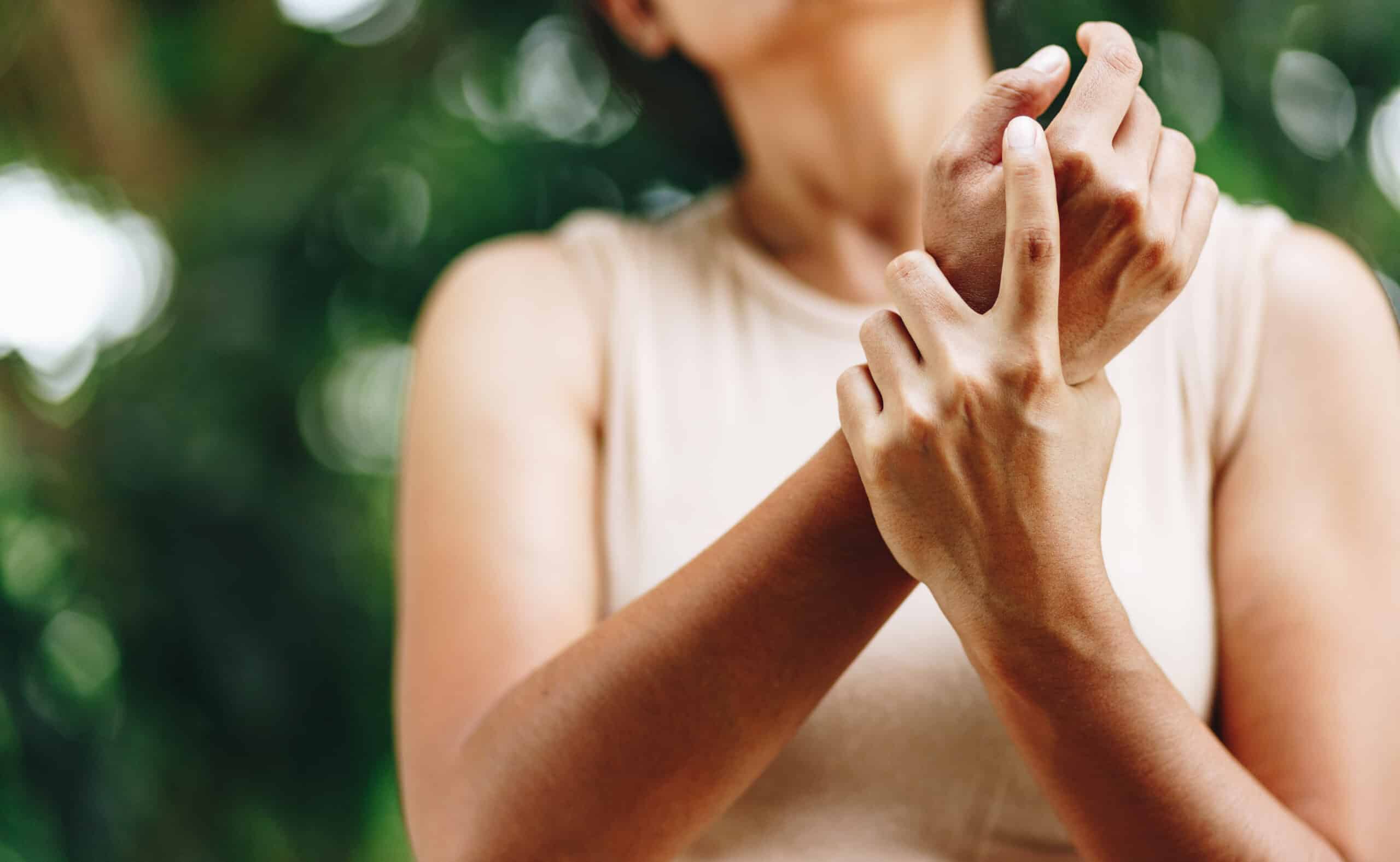 Woman suffering from CRPS in her arm after sustaining a past injury