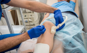 Patient receiving radiofrequency ablation treatment to help manage their knee pain.