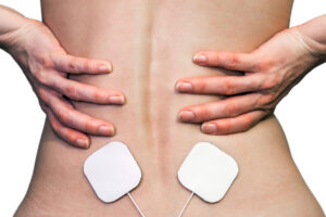 Close up of a patient getting spinal cord stimulation to help manage their neuropathic pain.